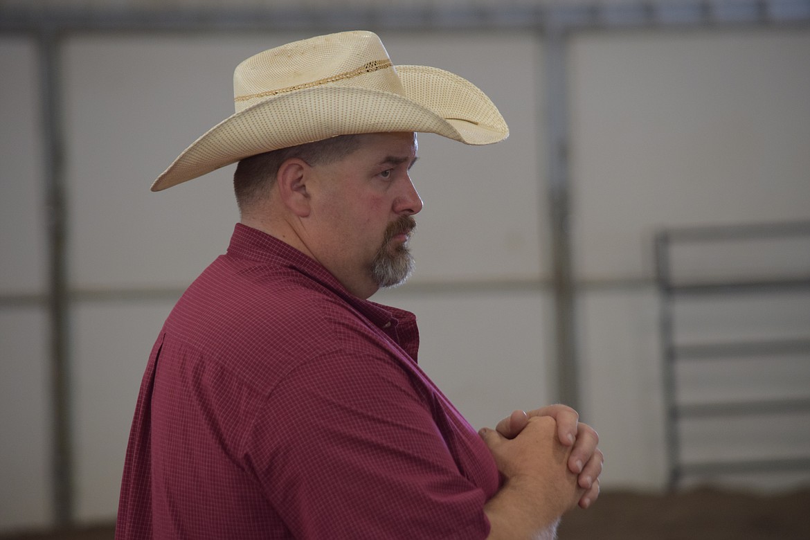 Judge Myles Tellefson, a rancher near Warden, evaluates the competitors in the ring at the Ardell Pavillion during a round of FFA cattle showing at this year’s Grant County Fair.