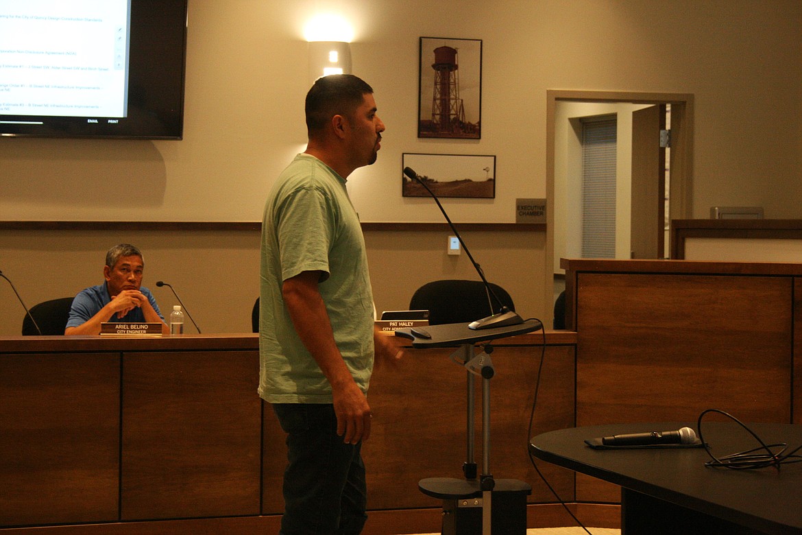 Quincy resident and truck owner Jose Ramirez speaks to the Quincy City Council on Aug. 16 about the work on B Street Northeast.