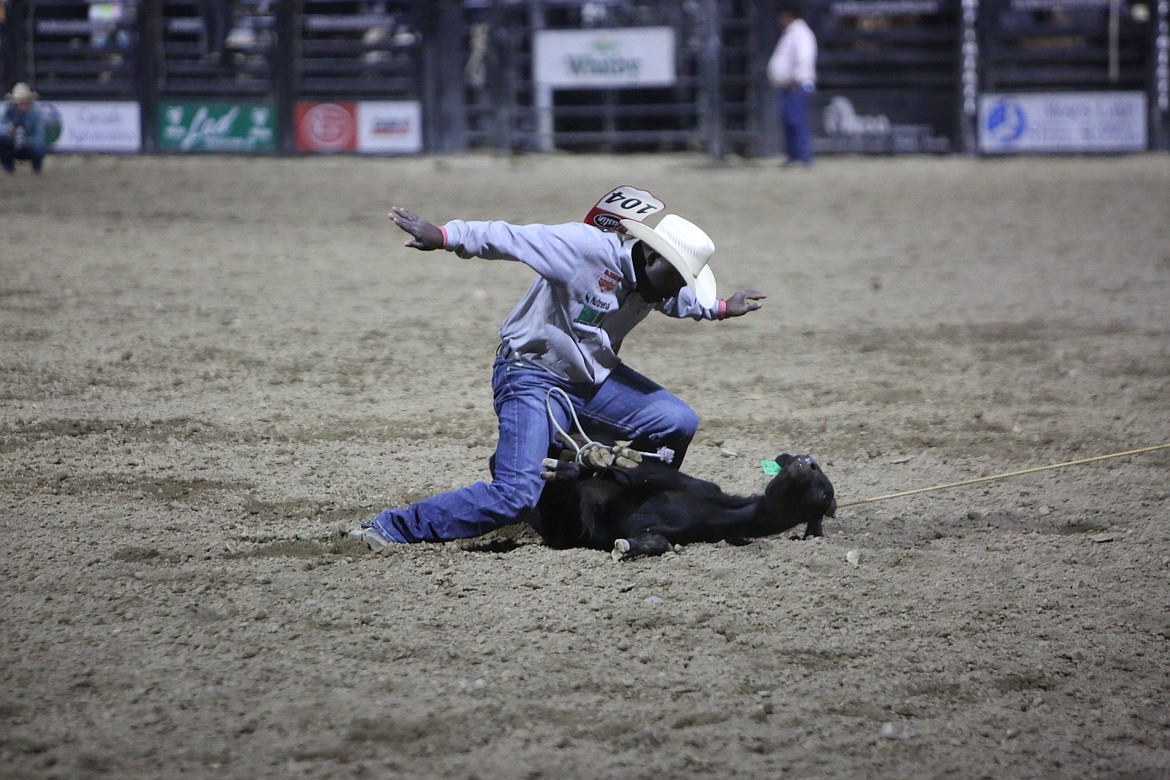 Tie down roper John Douch calls time during the tie down roping event on Thursday.