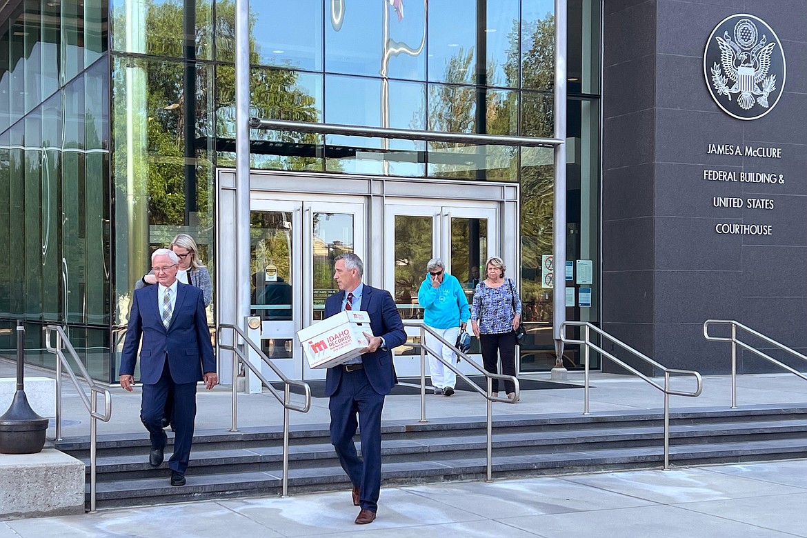 Attorneys Monte Stewart, left, and Daniel Bower, center, leave the James A. McClure Federal Building and Courthouse in Boise, Idaho, after oral arguments in a lawsuit brought by the U.S. Department of Justice against Idaho over the states near-total abortion ban on Monday, Aug. 22, 2022. Stewart and Bower are representing the Idaho Legislature, which contends the state's ban doesn't violate federal law governing emergency health care treatment in Medicare-funded hospitals. (AP Photo/Rebecca Boone)