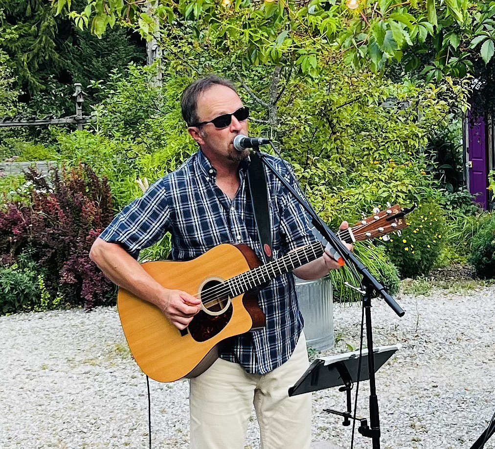 Singer Bill Bozly entertains the crowd during the Kiwanis Club of the Silver Valley's annual Concert in the Garden.