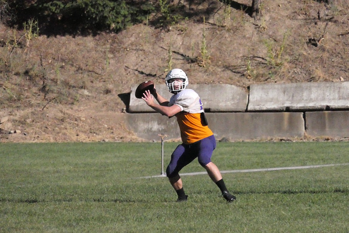 Senior quarterback Caleb Ball throws downfield in practice drills last week in Mullan, Idaho. The Tigers open against Superior this Friday at 7 p.m. in St Regis.  (Chuck Bandel/MI-VP)