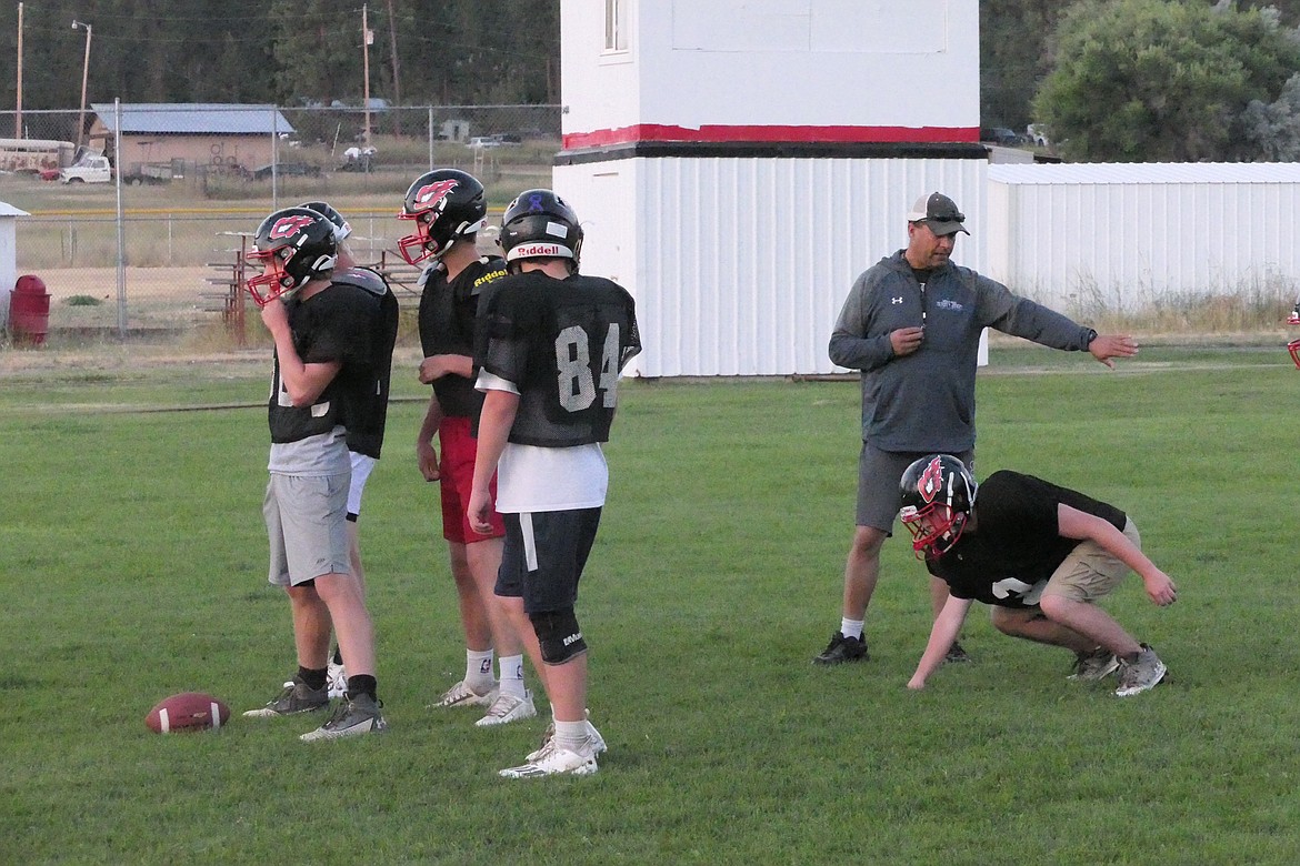 Head coach Jim Lawson works with the Savage Heat offense during practice in Hot Springs this past week.  (Chuck Bandel/VP-MI)