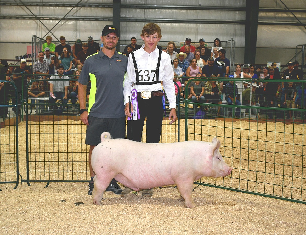 Tracen McIntyre sold his grand champion hog to Les Schwab Evergreen for $11 per pound at the annual Market Livestock Sale at the Northwest Montana Fair on Saturday, Aug. 20, 2022. (Courtesy of Alicia Craft Gower)