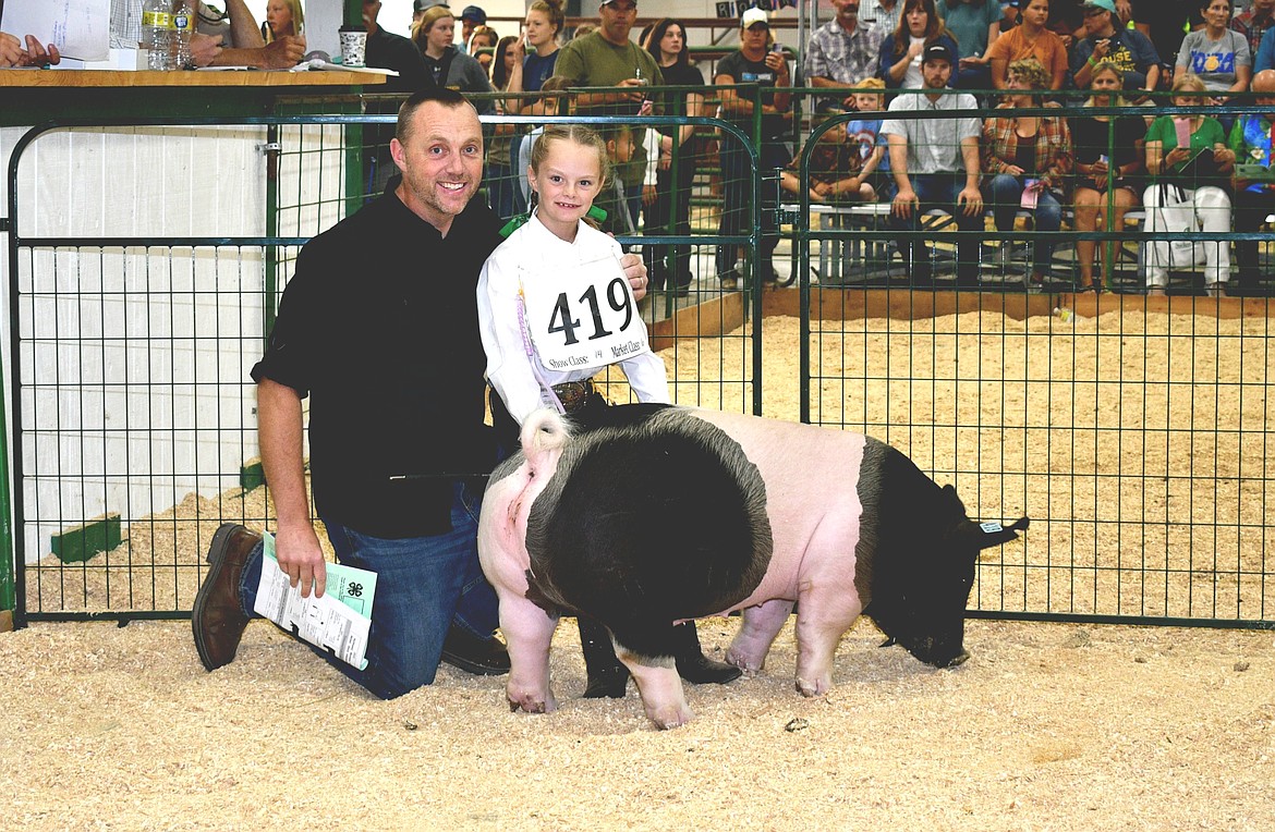 Kylee Oedekoven sold her reserve champion hog to Trailhead Church for $14.75 per pound at the annual Market Livestock Sale at the Northwest Montana Fair on Saturday, Aug. 20, 2022. (Courtesy of Alicia Craft Gower)