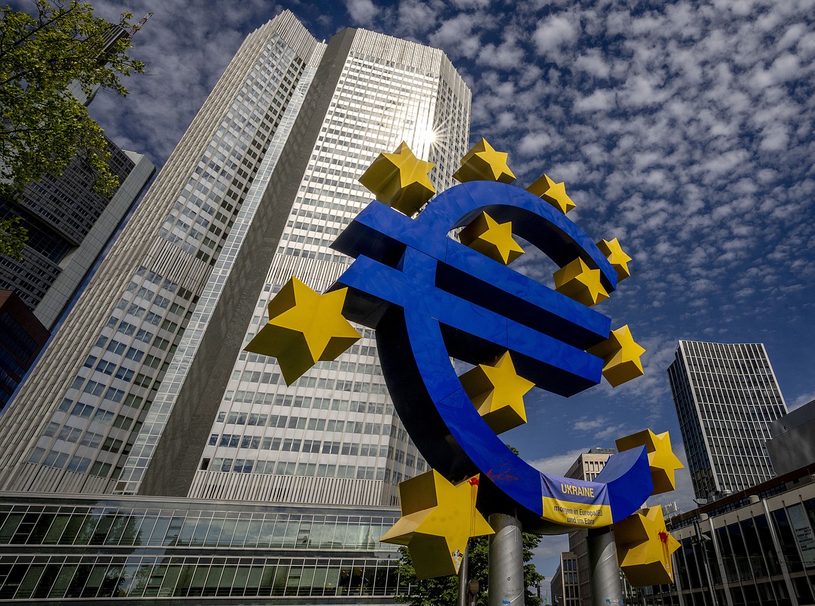 The Euro sculpture stands in front of the former European Central Bank in Frankfurt, Germany, on July 13, 2022. The euro has fallen below parity with the dollar, diving to its lowest level in 20 years and ending a one-to-one exchange rate with the U.S. currency. .(AP Photo/Michael Probst)