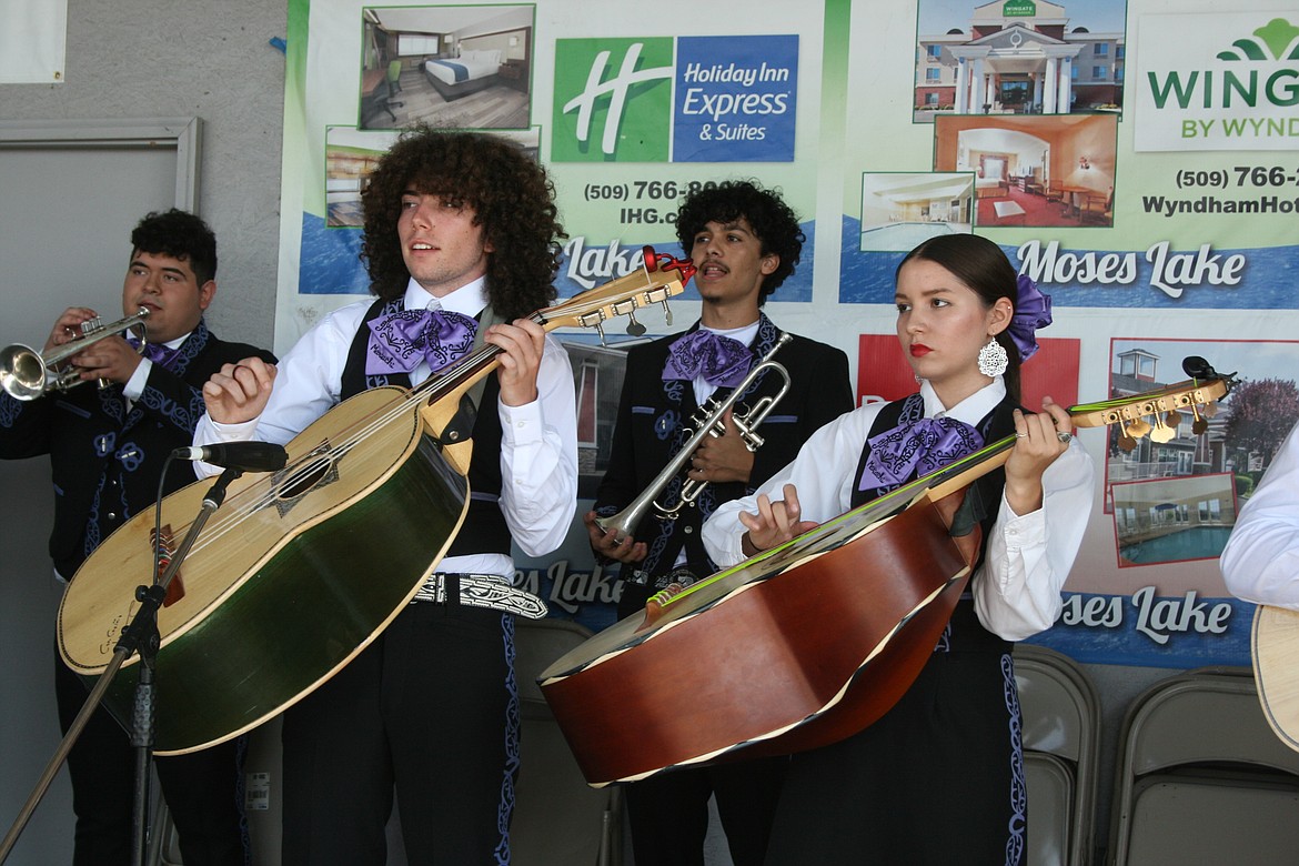 Guitarron (foreground) and trumpet players from Mariachi Huenachi perform for the crowd at the Grant County Fair Saturday.