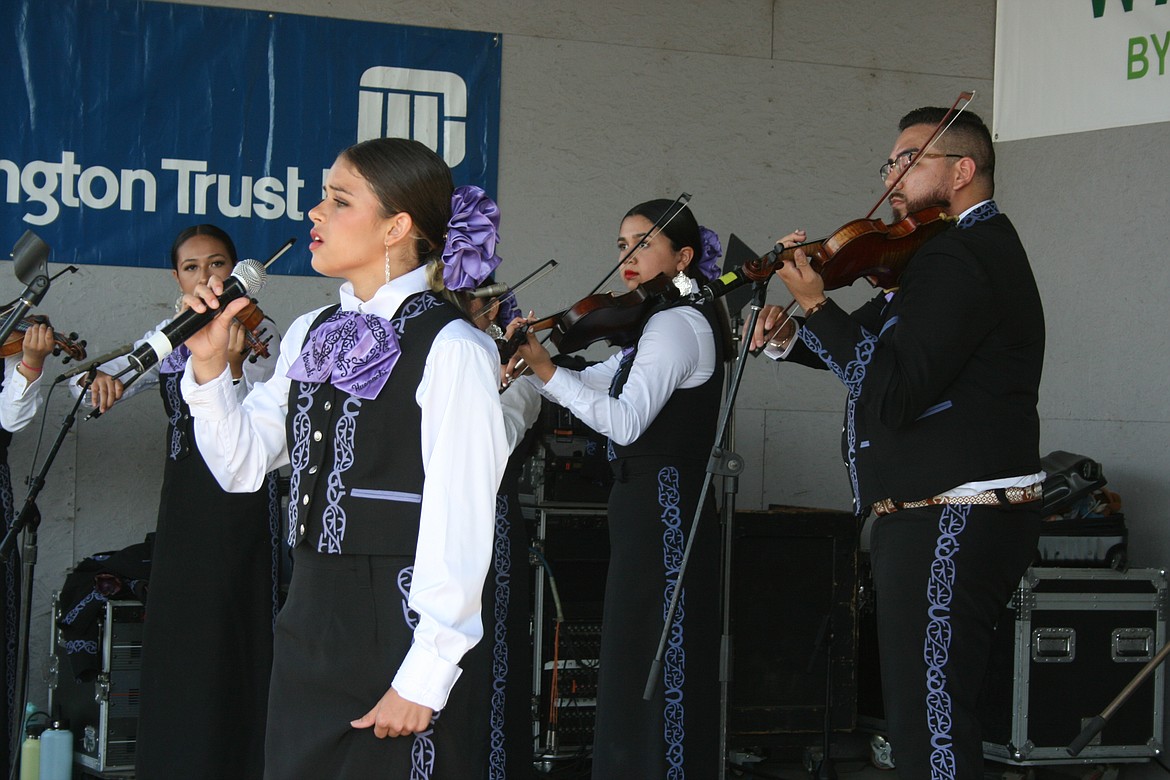 Delilah Cabrera sings a traditional song during Saturday’s performance by Mariachi Hueachi at the Grant County Fair.