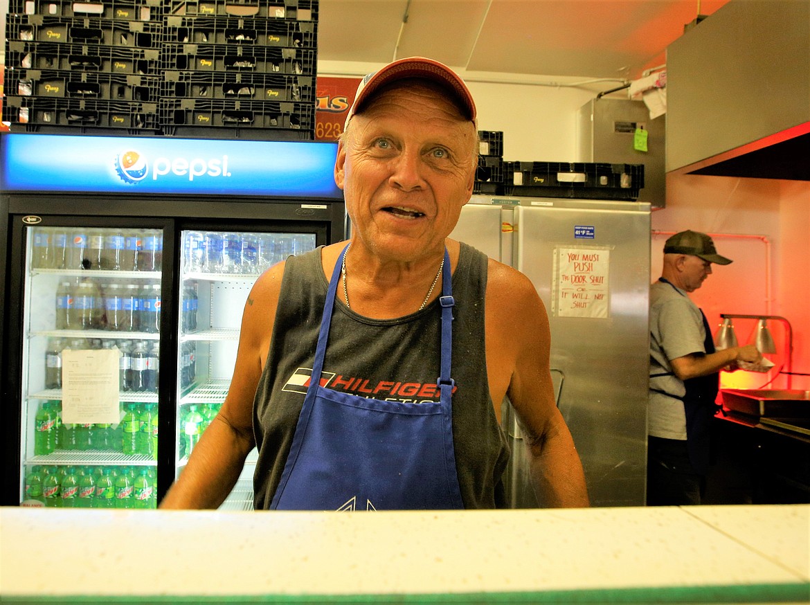 Knight of Columbus member Phil Hostak chats about being part of the Dog House crew on Tuesday at the North Idaho State Fair.