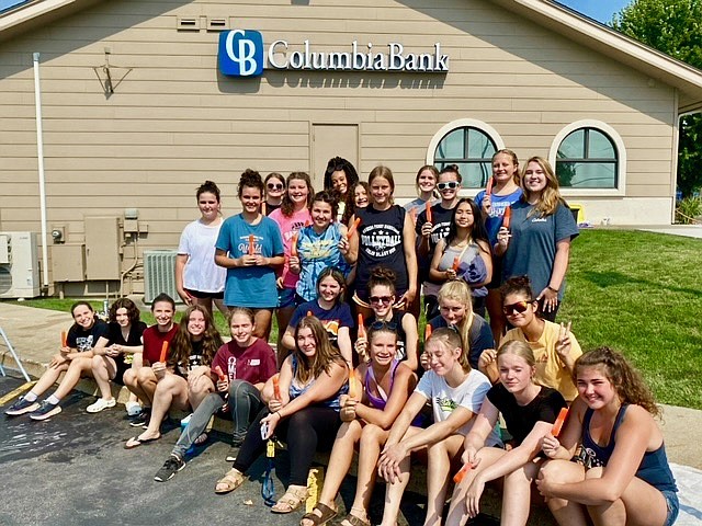 BFHS volleyball players at their car wash fundraiser.