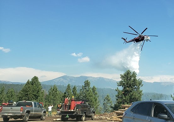 An air attack is conducted on on the Moyie Fire just southeast of the Idaho Forest Group Mill in Moyie Springs.