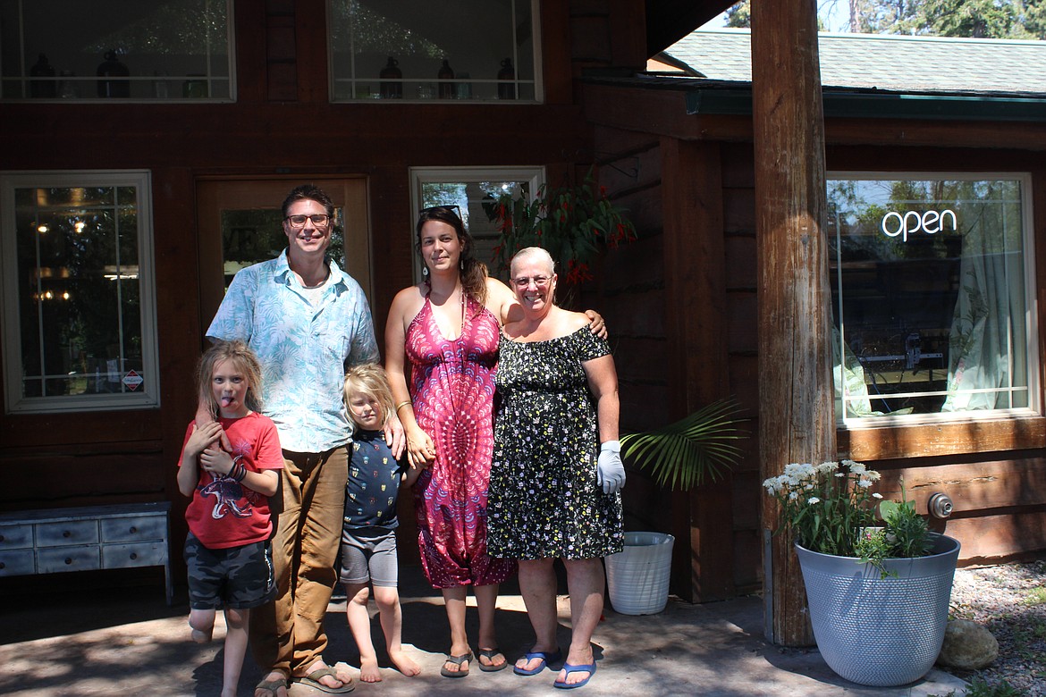 The Good Stuff Botanicals founders Michael and Maranda Johnson stand in front of the shop in Bigfork with their kids Everest and Finn and Product Specialist Judy Durant. (Taylor Inman/Bigfork Eagle)