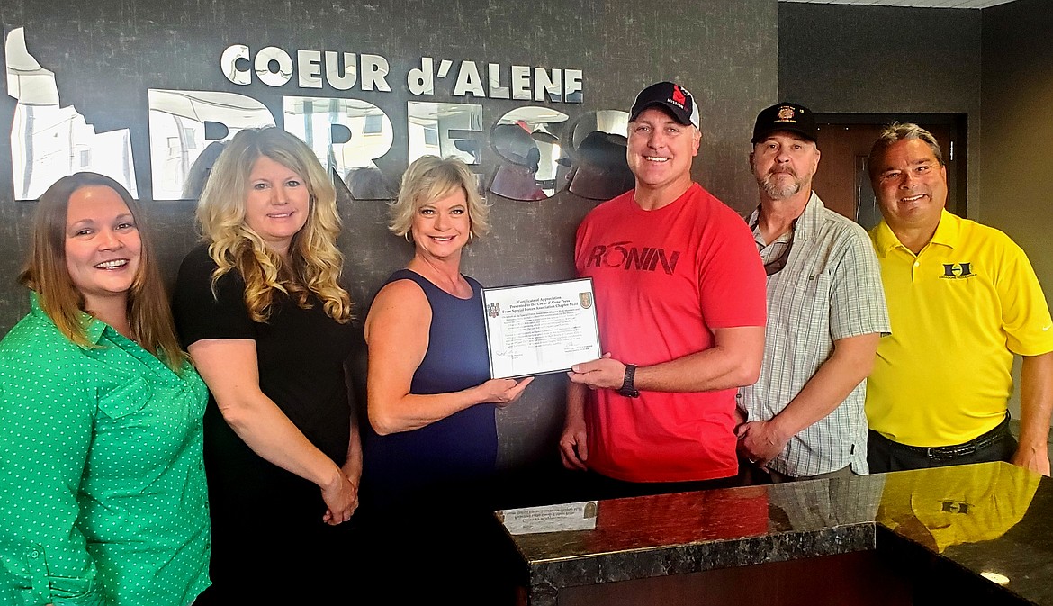 Special Forces Association Chapter XLIII representatives presented the Coeur d'Alene Press with a certificate of appreciation on Thursday. From left: Devin Weeks, Shannon Lynch and Angie High, Coeur d'Alene Press; Chapter President Command retired Sgt. Maj. Jason Legler and Chapter Vice President retired Sgt. Maj. Stephen "Durf" Durfee; and Kelly Redfearn, Coeur d'Alene Press.