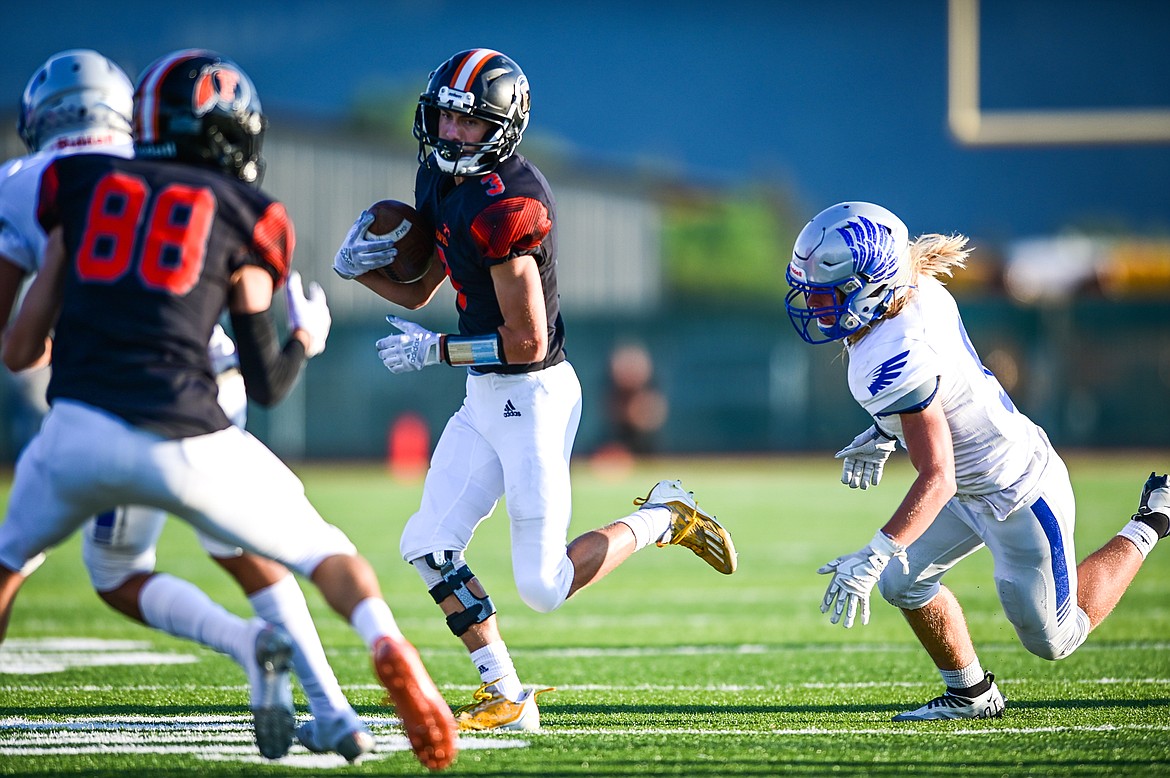 Flathead wide receiver Bobby Walker (3) runs after catching an option toss from quarterback Jackson Walker in the first quarter against Billings Skyview at Legends Stadium on Friday, Aug. 26. (Casey Kreider/Daily Inter Lake)
