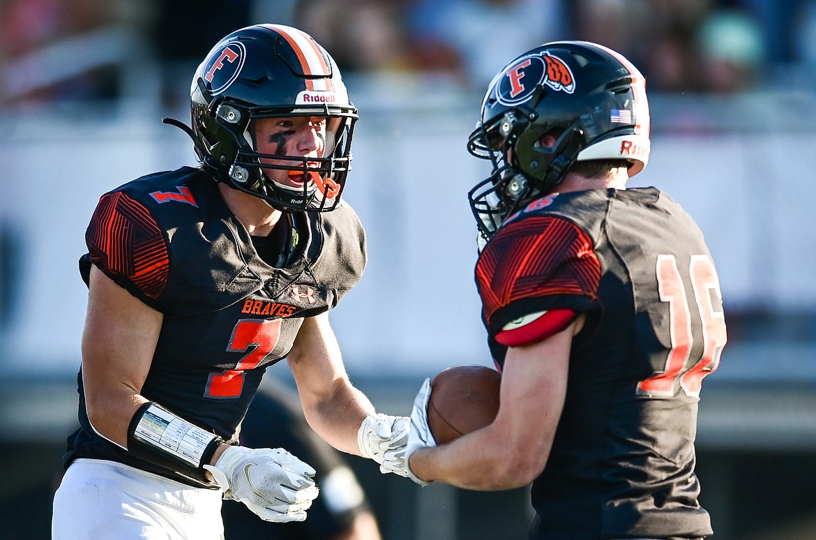 Flathead's Stephen Riley (7) celebrates with Tanner Heichel (16) after Heichel recovered a fumble in the first half against Billings Skyview at Legends Stadium on Friday, Aug. 26. (Casey Kreider/Daily Inter Lake)
