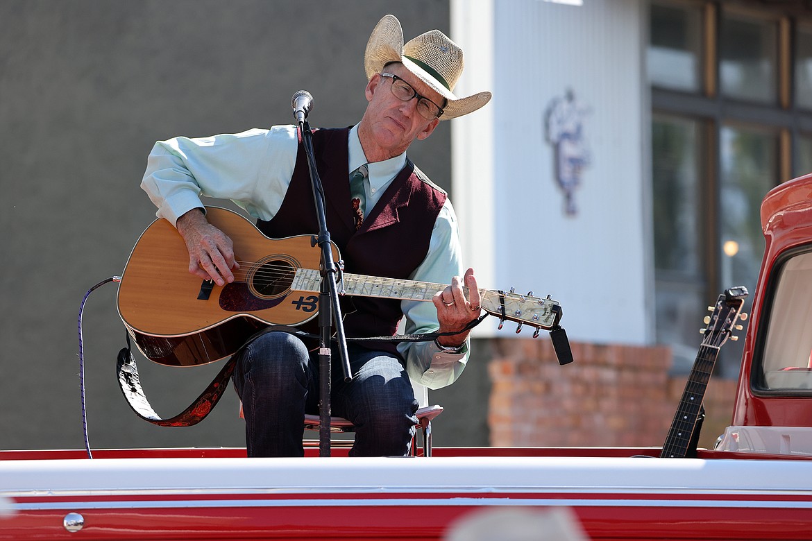 Singer, songwriter and world renowned yodeler Wylie Gustafson of Conrad entertains the crowd at the new Columbia Falls Farmers Market from the bed of his pickup truck July 31. (Jeremy Weber/Daily Inter Lake)