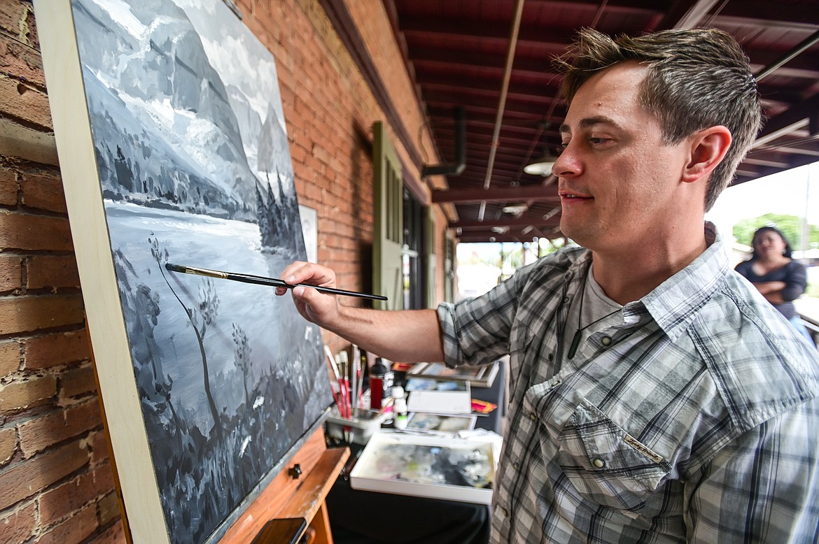 Artist Kenneth Yarus works on a rendition of a Clarence Rundell mural for the Kalispell Downtown Association and KALICO Art Center's Downtown Art Challenge on Saturday, Aug. 27. Ten artists each referenced a different Clarence Rundell mural that Rundell painted in 1936 in what is now Rocky Mountain Outfitter on Main Street in Kalispell. The paintings will be hung up and on view in  several downtown businesses from Aug. 31 to Sept. 8, during which time all of the paintings will be up for auction on the following online platform: https://app.galabid.com/kdachallenge/items. (Casey Kreider/Daily Inter Lake)