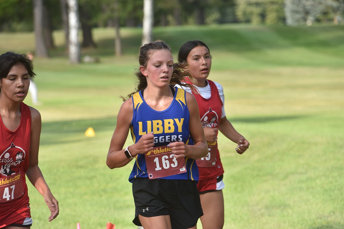 Libby sophomore Bergen Fortner runs in the Libby Inviational Friday, Aug. 30, at Cabinet Heights Golf Course. (Scott Shindledecker/The Western News)