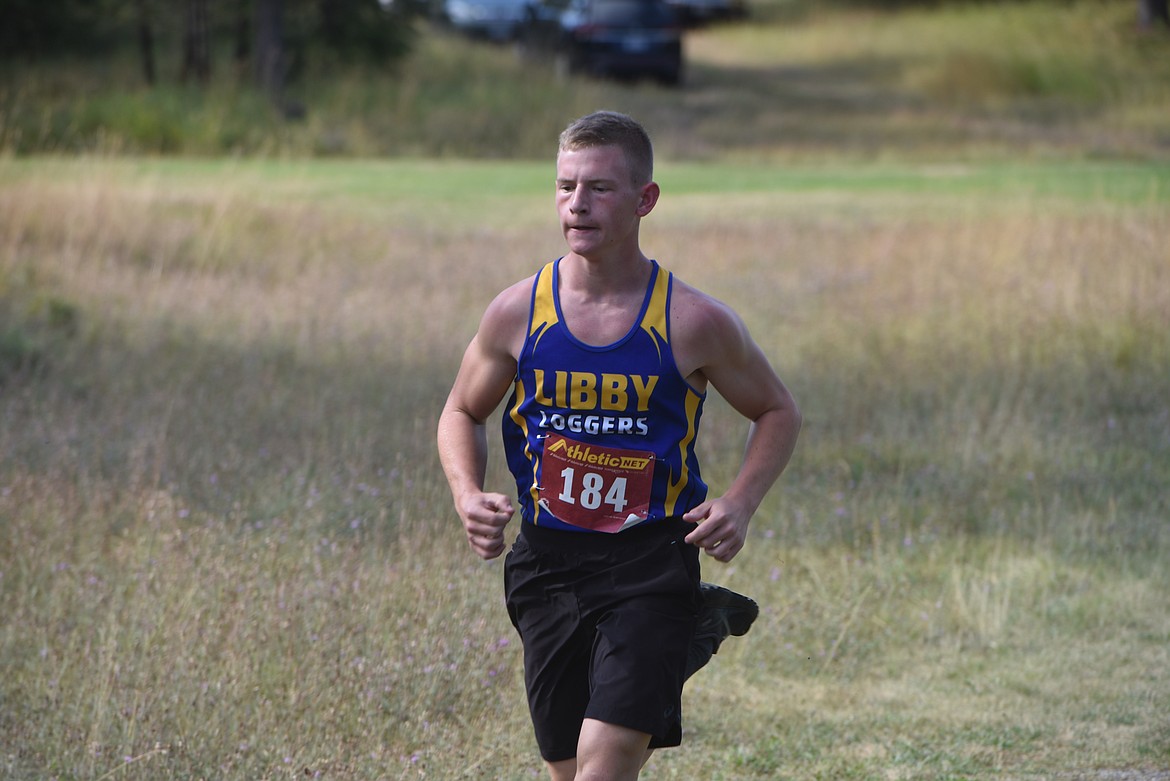 Libby sophomore Greysen Thompson runs in the Libby Invitational Friday, Aug. 30, at Cabinet Heights Golf Course. (Scott Shindledecker/The Western News)