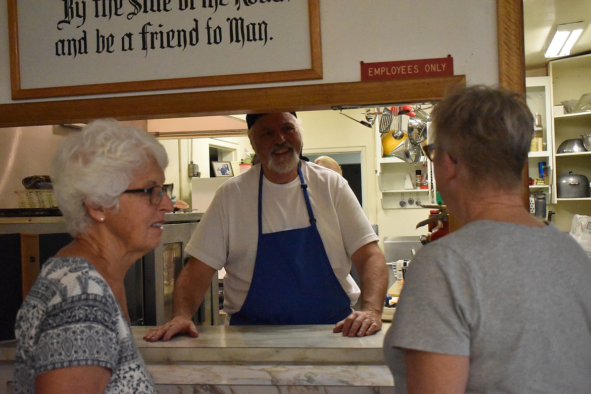 Perry McClellan, president of the Soap Lake Community and Senior Center, smiles as he speaks to a couple of people who came to the center for the breakfast fundraiser Saturday morning.