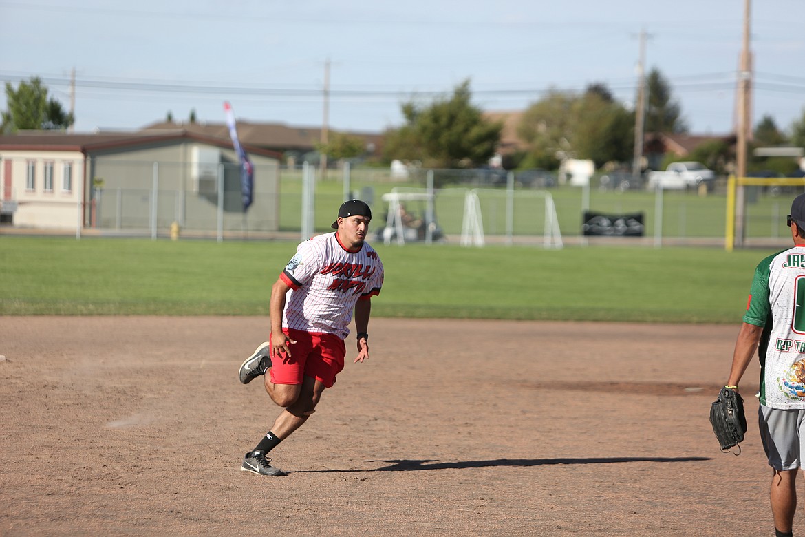 A Gorilla Mafia player runs to third base after being advanced on a hit ball.