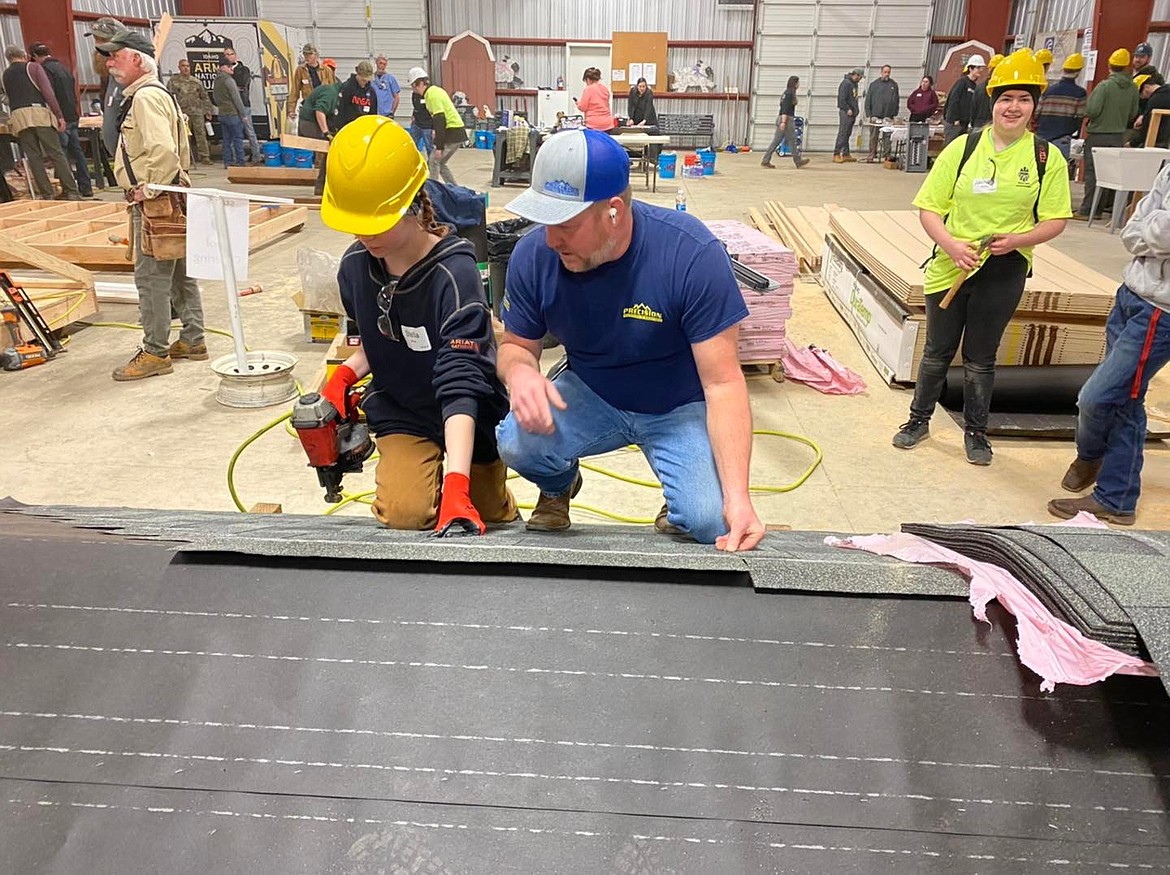 Students worked with skilled professionals during Construction Combine to build sheds that were given to local veterans.