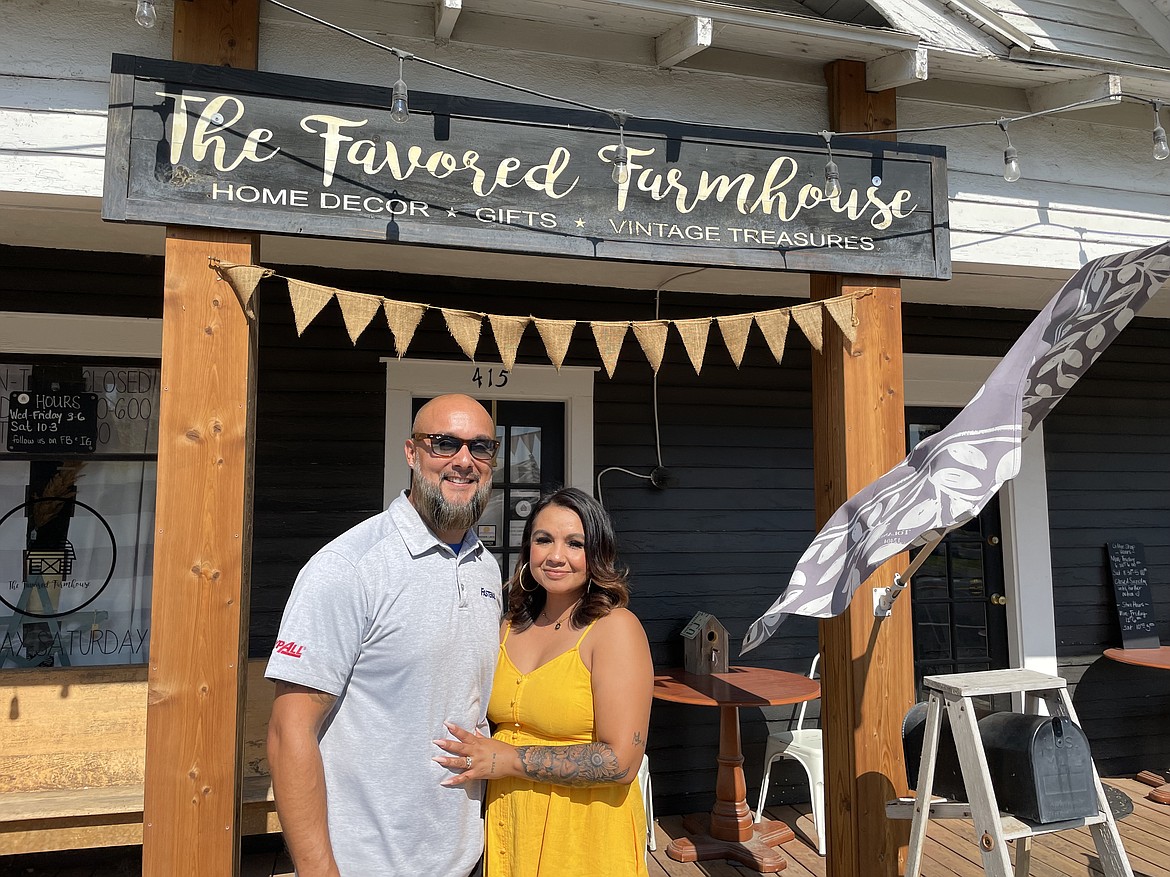 Derek and Daphne Martinez in front of their business, The Favored Farmhouse, which serves coffee drinks, mixed soda drinks, vintage furniture and clothing, and homemade goods like candles and soap.