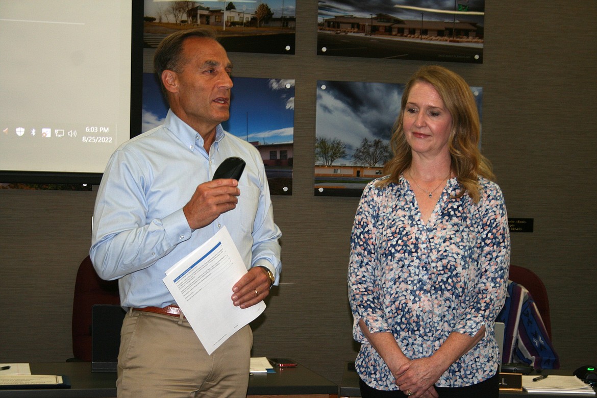 Moses Lake School District Director of Finance Stefanie Lowry, right, is recognized by MLSD superintendent Monty Sabin for her work on the district’s annual audit during Thursday’s Moses Lake School Board meeting. Lowry prepared the 2022-23 budget which was approved by the board.