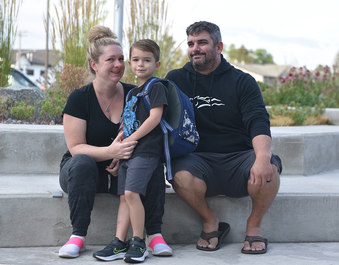 Danielle, Henry and Sam Olson arrive for the first day of first grade at Muldown Elementary School last week. (Julie Engler/Whitefish Pilot)