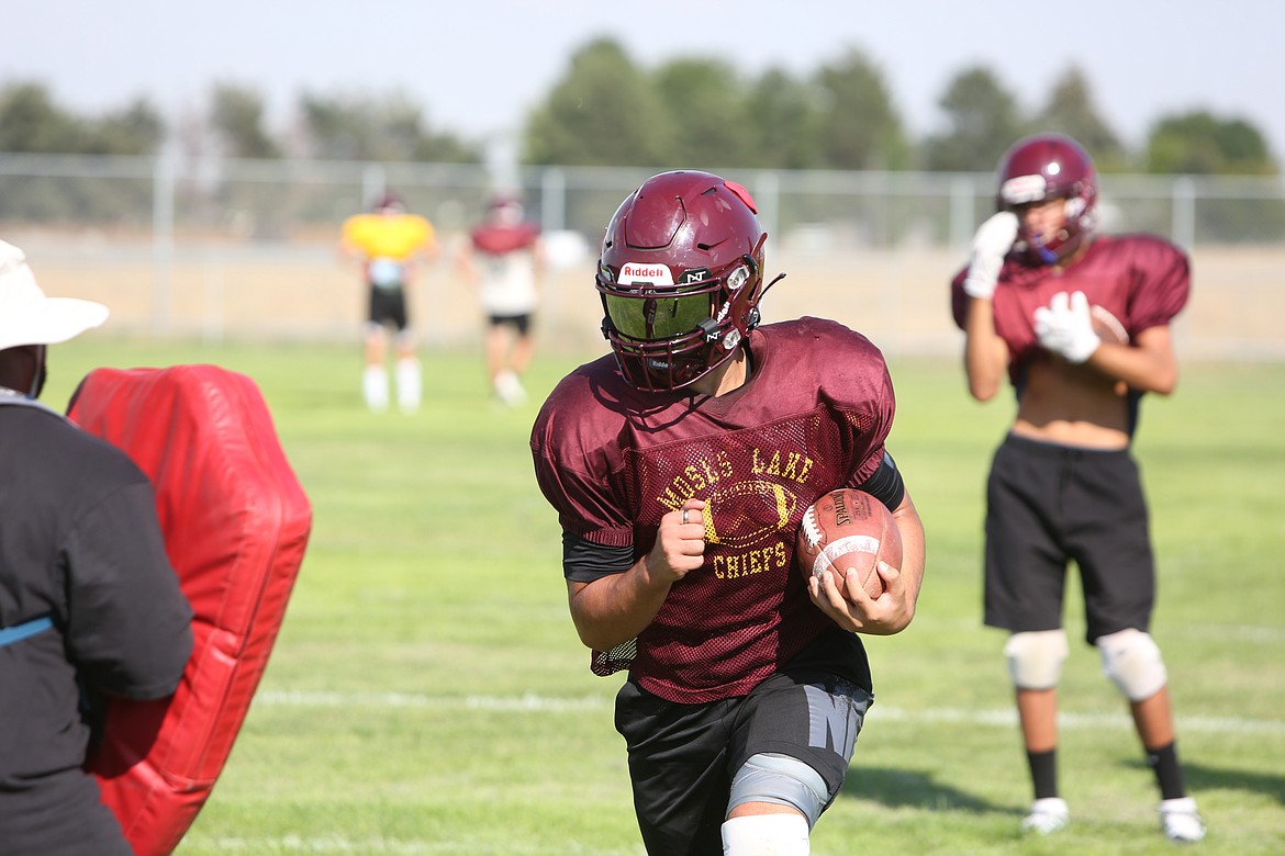 Moses Lake running backs work on staying in the field after being hit near the sideline.