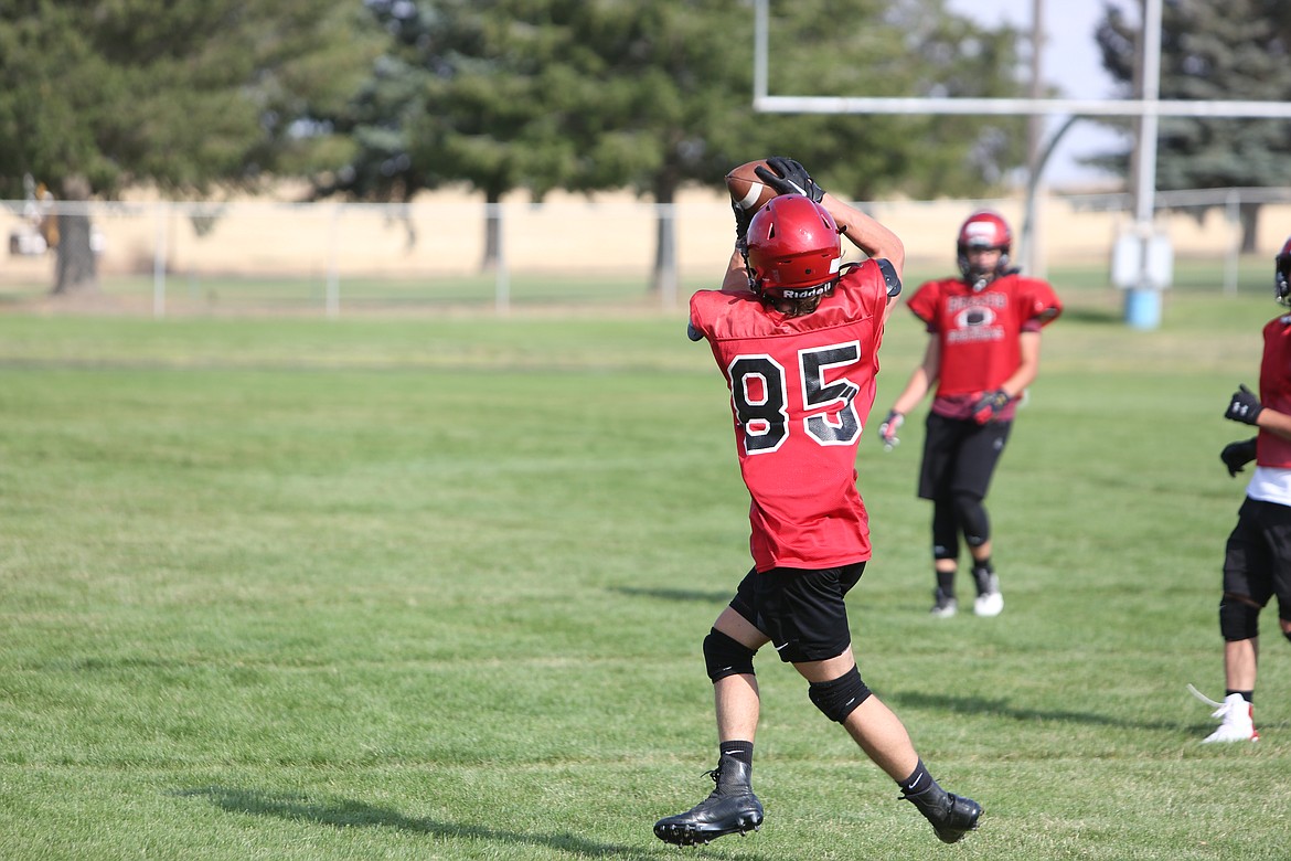 Hayden Melcher cuts upfield after catching a pass in the back field during Lind-Ritzville’s football practice.