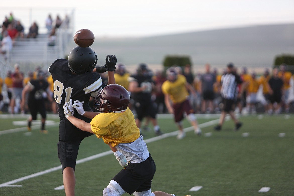 A Moses Lake defensive back breaks up a pass against a Royal receiver during the jamboree held at Royal High School.