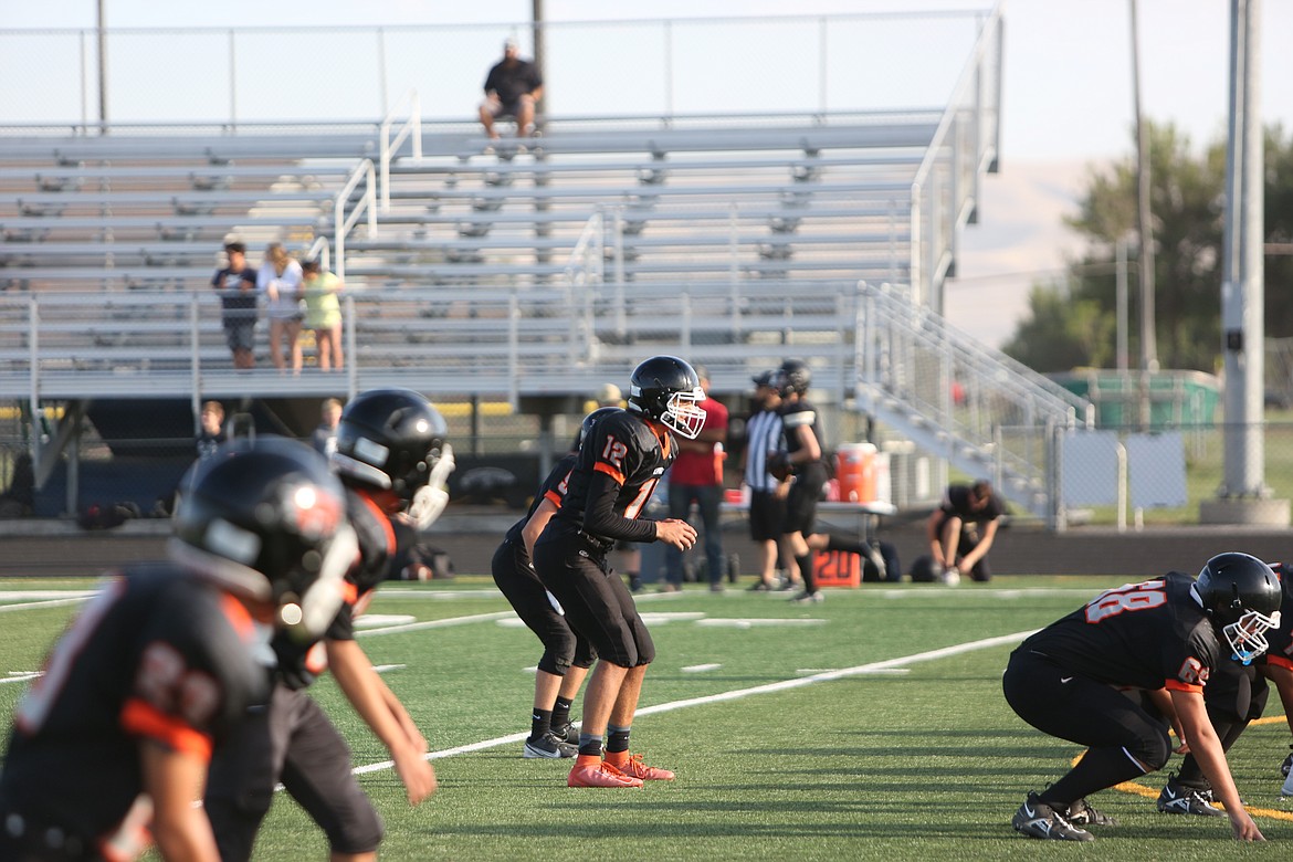 Ephrata quarterback Travis Hendrick waits for the snap during the jamboree held at Royal High School.