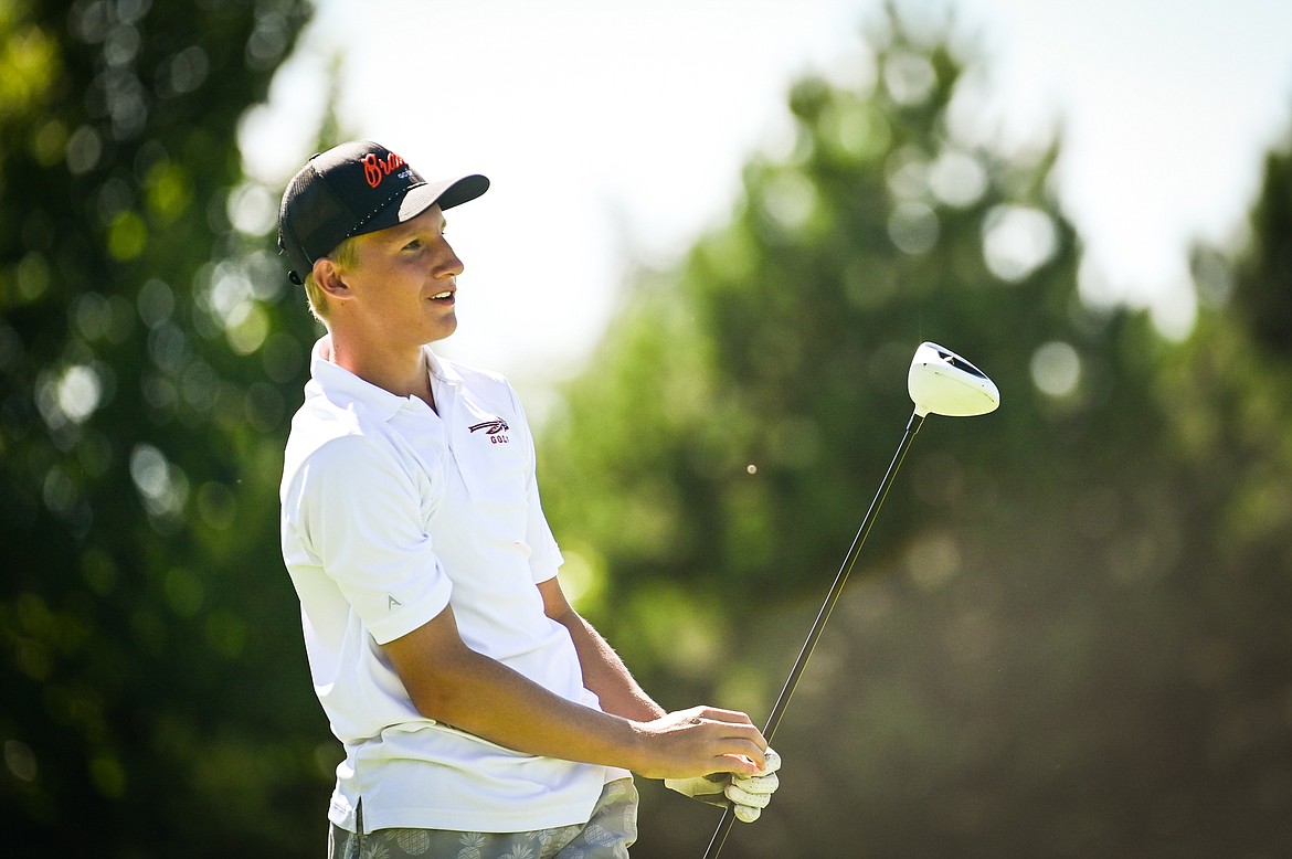 Flathead's (No.3 or 4 boys) watches his drive on the 10th tee during the Crosstown Cup at Village Greens Golf Course in Kalispell on Tuesday, Aug. 30. (Casey Kreider/Daily Inter Lake)