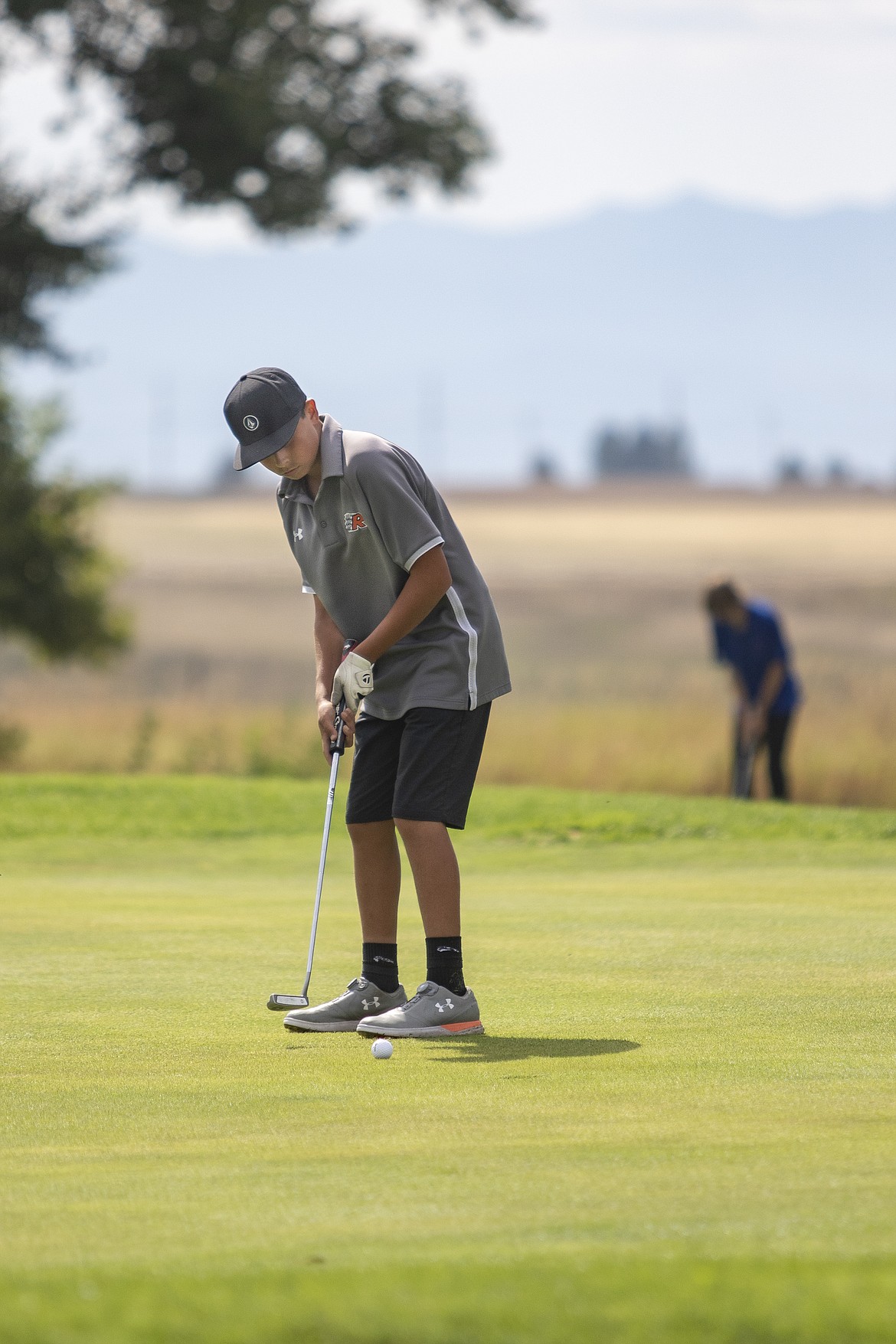Ronan Chief Nash Niemeyer watches his putt roll in the cup for par during the Ronan Invitational at Mission Mountain Golf Course on Thursday.