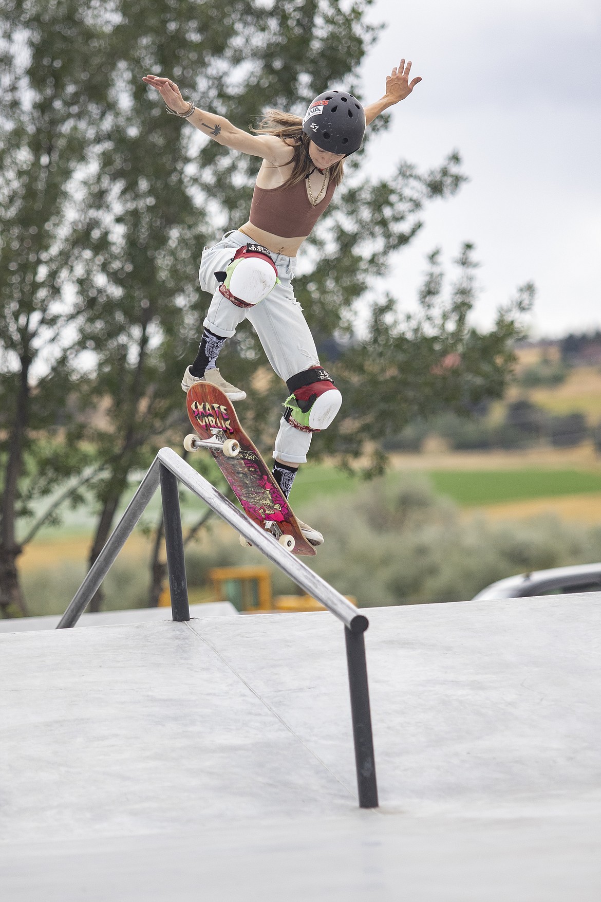 Rachelle Tomlinson rides the rail during Skate Jam hosted at Polson’s Seventh Avenue Skateboard Park on Sunday.