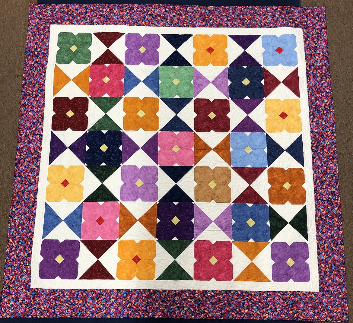 The "Flower Glass Quilt" made and donated by the Mountain Brook Ladies Club will be raffled at 6:30 p.m. Sept. 10 duriing the Mountain Brook Fall Pie and Ice Cream Social, which takes place from 4 to 7 p.m. at the Mountain Brook Community Center.