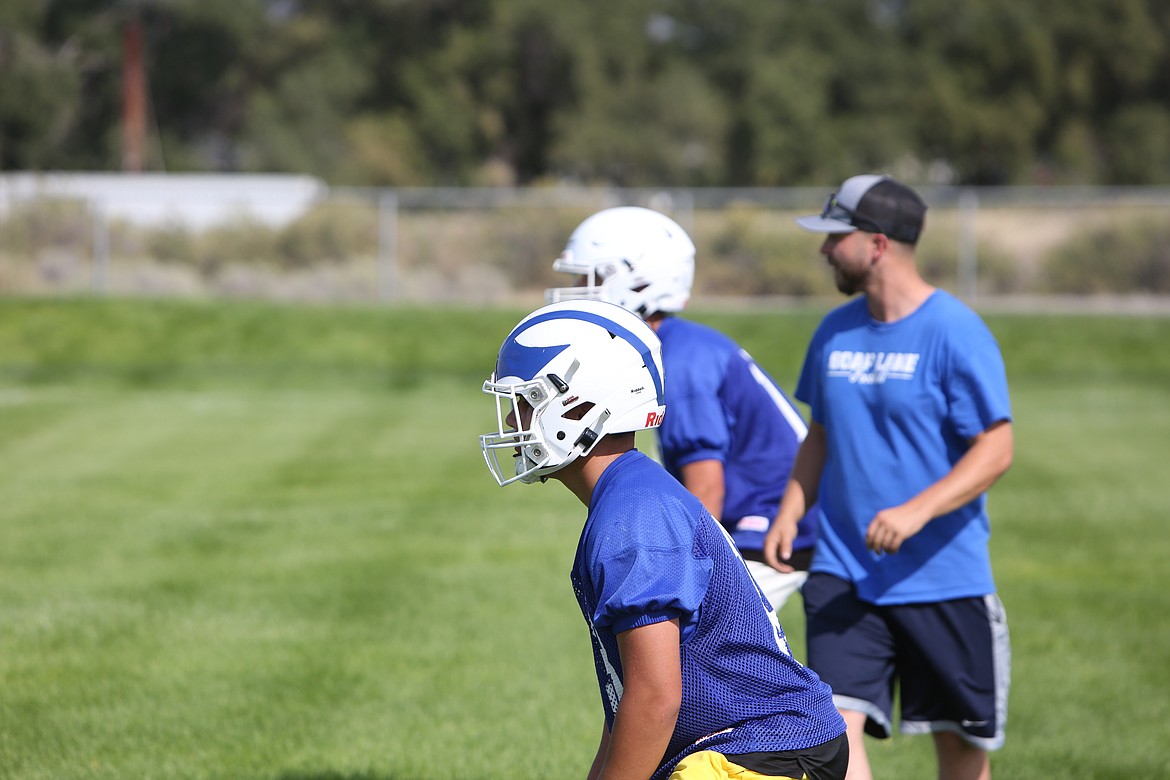 Soap Lake linebackers work with their new head coach Garret Devine during the first week of fall camp.