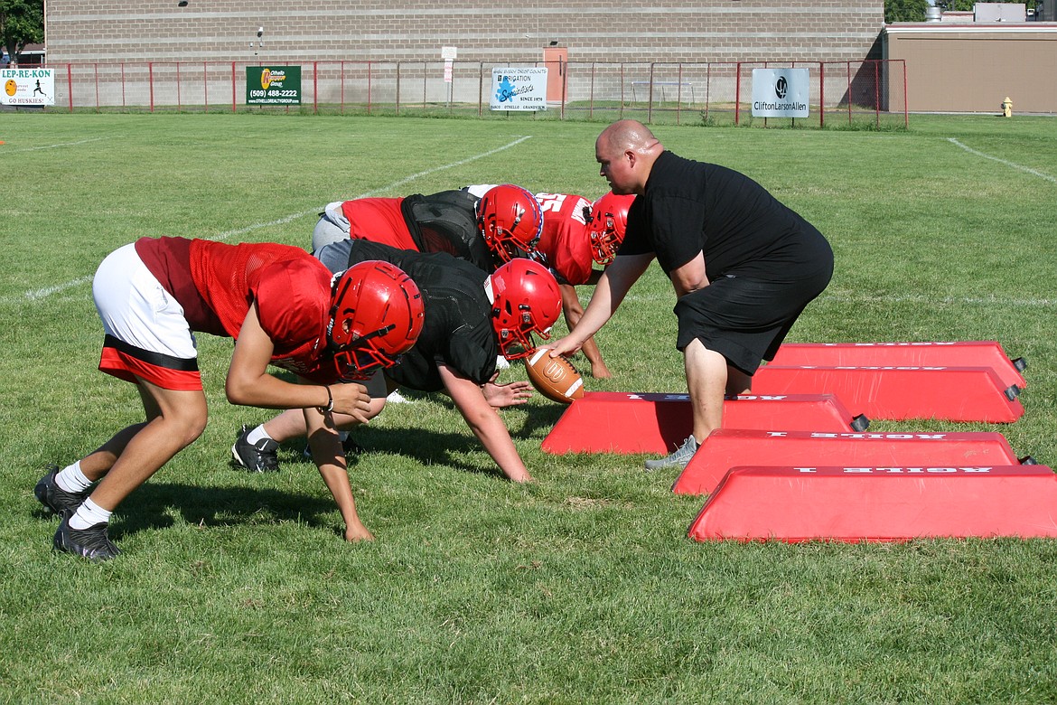 Linemen hone their reaction to snap counts during Othello High School football practice Aug. 23.