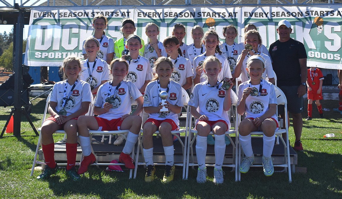 Courtesy photo
The Thorns North FC 11 girls Academy competed at the River City Challenge this past weekend, going undefeated and taking first place in the U13 Silver Bracket. The Thorns defenders, Emily Hackett, Ava Langer, Ella Linder, Olivia Nusser, Vivian Hartzell and keepers Constance Ovendale, Mackenzie Dolan and Sophia Harrington play an outstanding weekend, holding the Thorns opponents to only 1 goal for the tournament. The girls started the tournament with a win against FC Spokane G2010 Yellow Dalton (8-0). Riley Greene (2), Kylie Lorona (2), Aubrey Sargent (2), Constance Ovendale all scored for the Thorns 11G Academy with assists from Presley Moreau and Olivia Hynes. Game two ended with a 1-0 win over Thorns North FC Sandpoint Strikers 2010G with a goal from Kylie Lorona. The girls then beat Eastern Washington Surf SC G10 Staples 1-0 with another goal from Kylie Lorona. The tournament final was played against Thorns North FC Sandpoint Strikers 2010G. Presley Moreau scored the lone goal for the 11G in a 1-1 tie, leading to a shootout with Olivia Nusser, Presley, Sophia, Olivia Hynes all successfully completing their shoots to beat the Sandpoint Strikers 4-3 in the shootout. Constance Ovendale blocked two Sandpoint shots. In the front row from left are Sophia Harrington, Mackenzie Dolan, Presley Moreau, Olivia Hynes and Riley Greene; second row from left, Aubrey Sargent, Payton Brennan, Victoria Howard, Kylie Lorona and Ava Langer; and back row from left, Olivia Nusser, Constance Overdale, Zoe Lemmon, Vivian Hartzell, Brightyn Gatten, Ella Linder, Emily Hackett and coach Mark Plakorus.