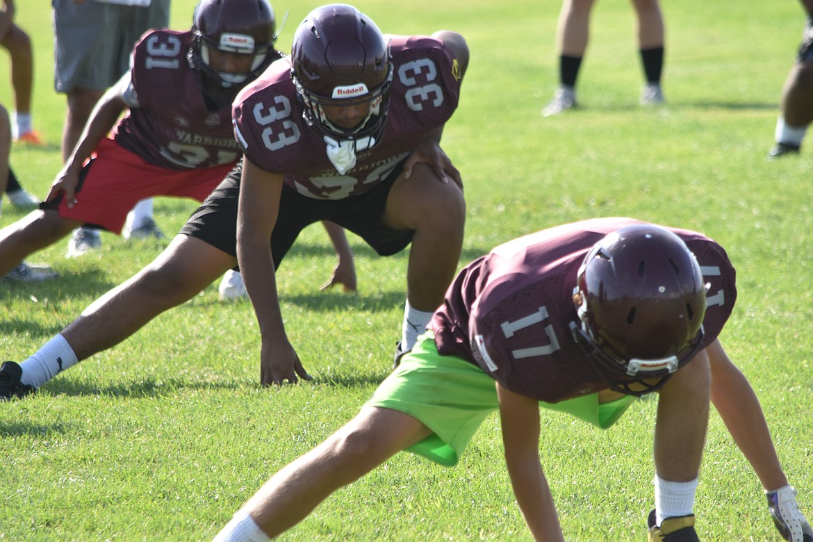 Wahluke players stretch at the beginning of practice, learning the fundamentals and preparing themselves for the season ahead.