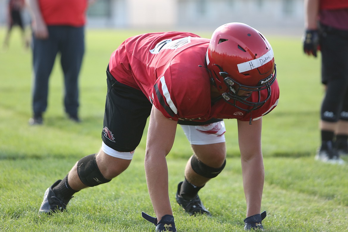 Defensive end Hunter Dinkins lines up for a drill during practice.