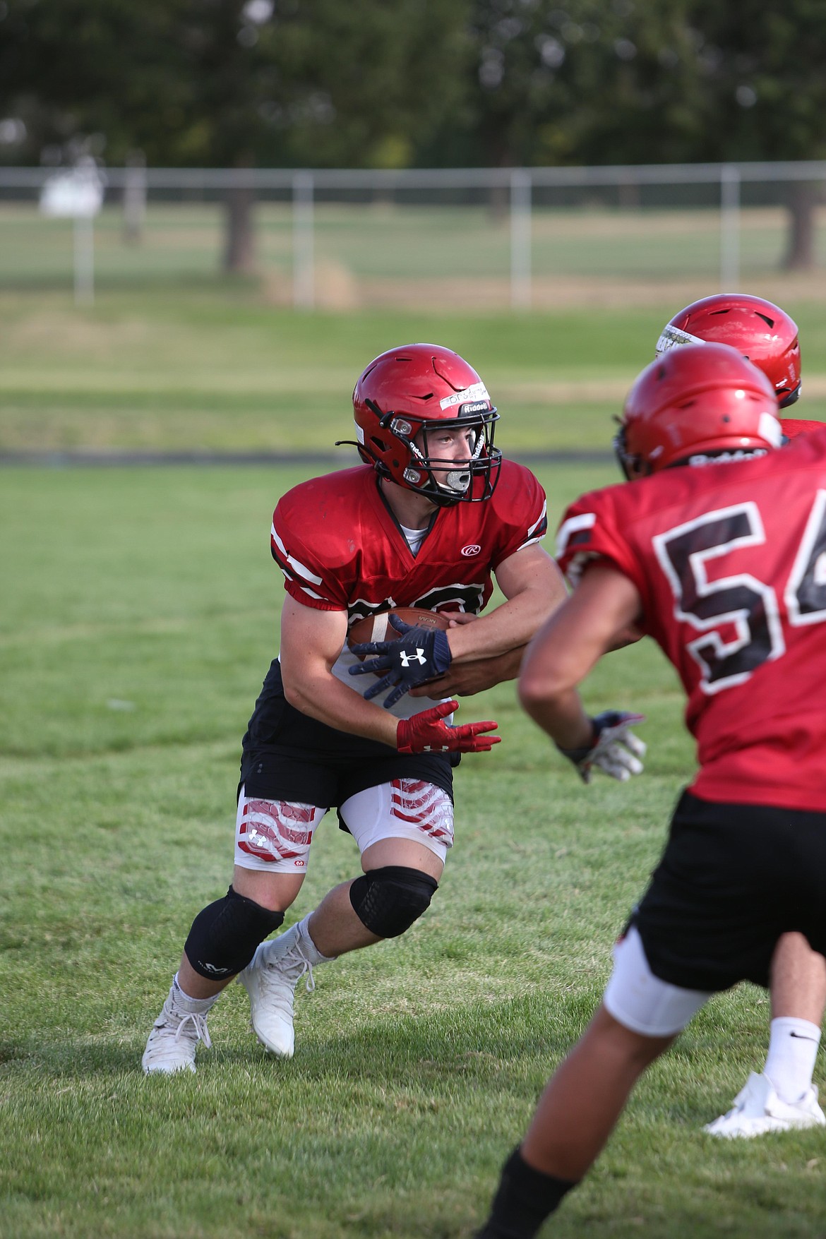 Running back Brody Boness takes a handoff during practice.