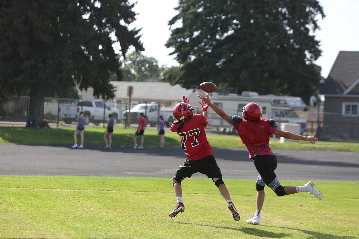 Receivers work through the different routes of the route tree during practice.