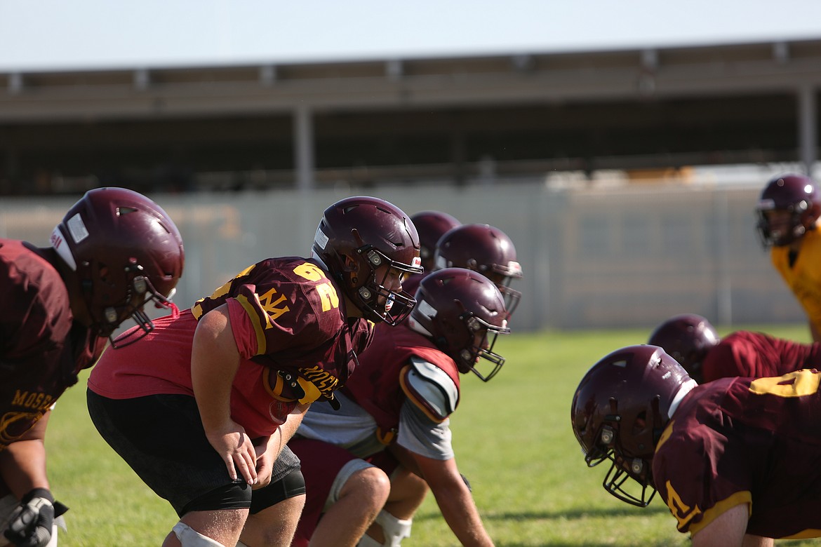 The Moses Lake offensive line lines up against the team's defense during practice.