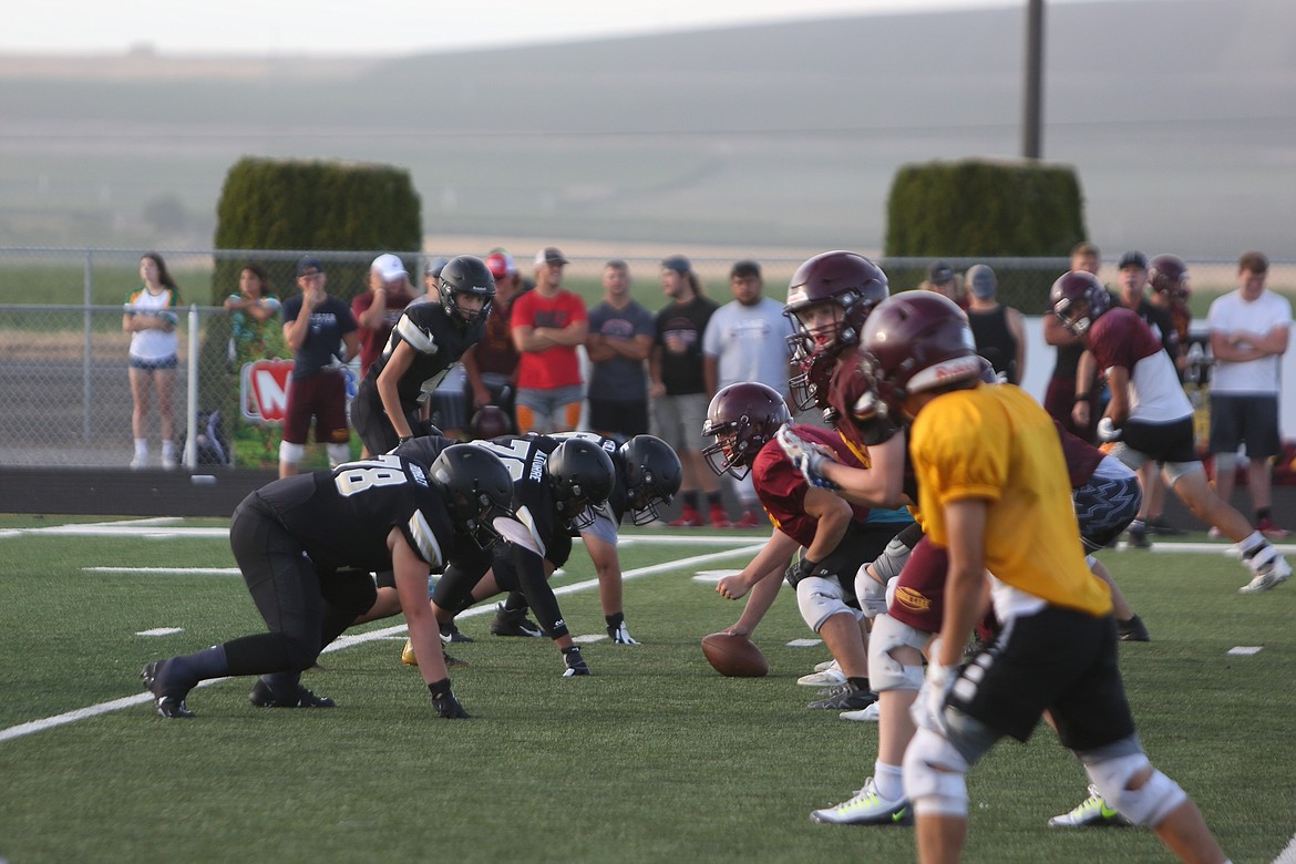 The Royal defensive line gets set against Moses Lake during a jamboree.