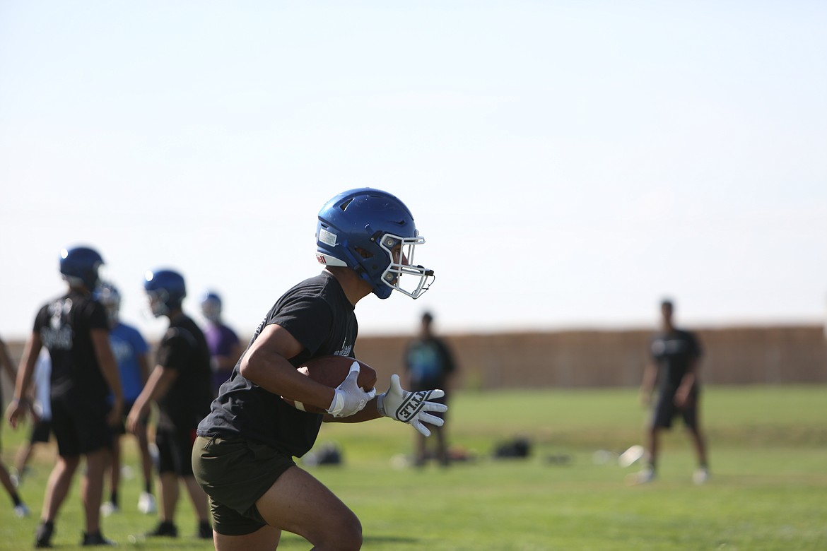 Senior Israel Hernandez cuts upfield after catching a pass.