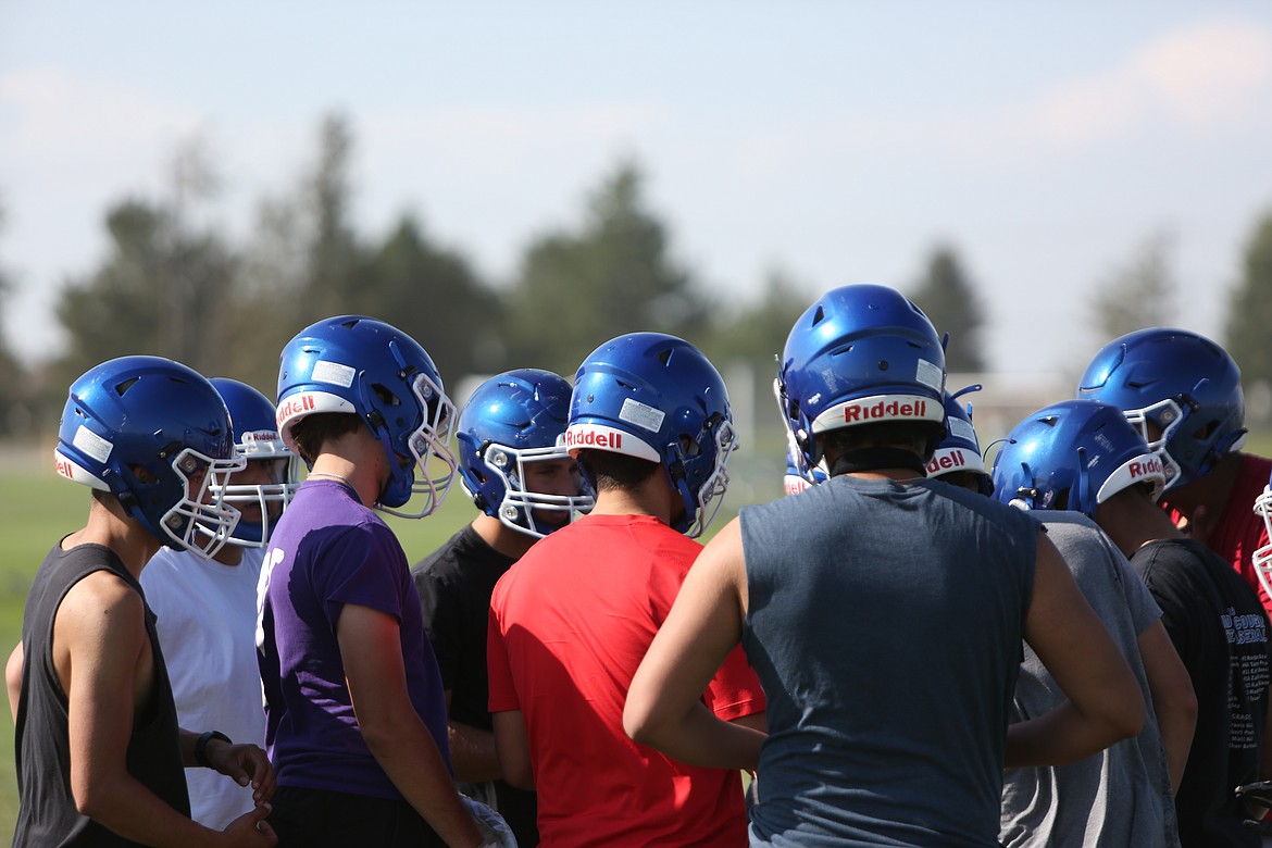 The Warden offense huddles up before calling a play during practice. Head coach Robert Arredondo said that the Cougars have run a similar offense in each of his eight years of coaching at Warden.