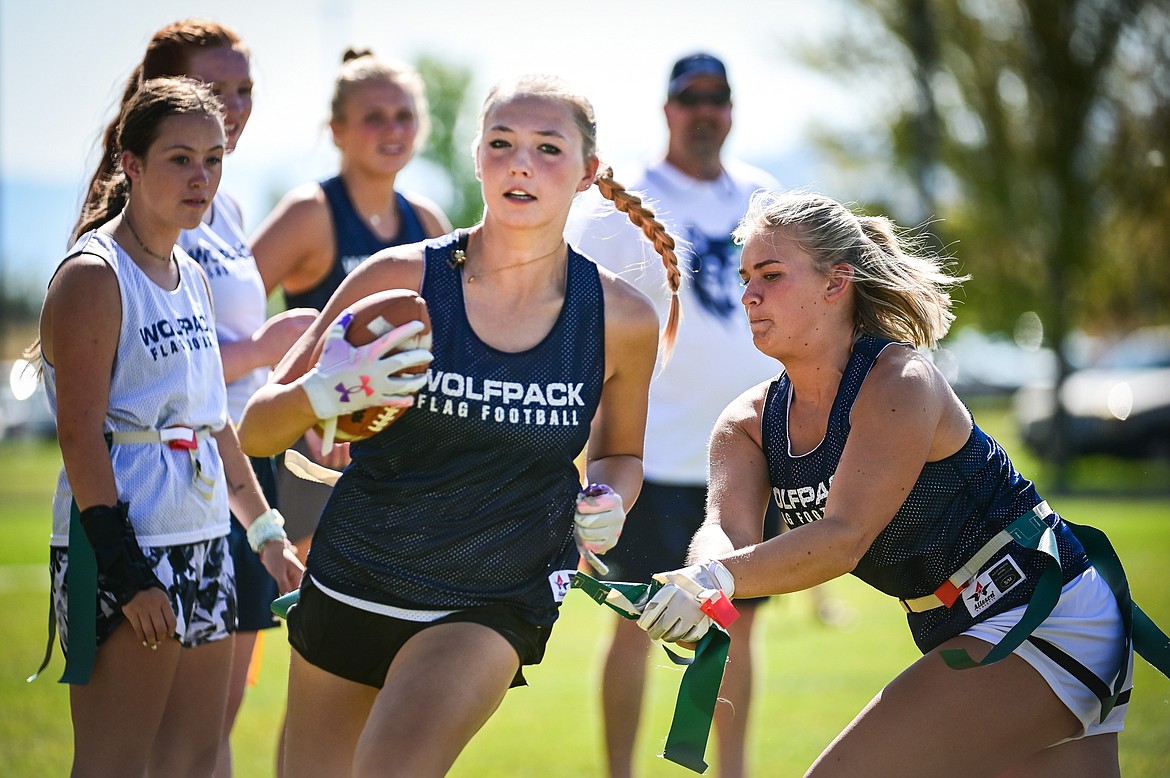 Glacier teammates work on a tackling drill during flag football practice outside Glacier High School on Wednesday, Aug. 31. (Casey Kreider/Daily Inter Lake)