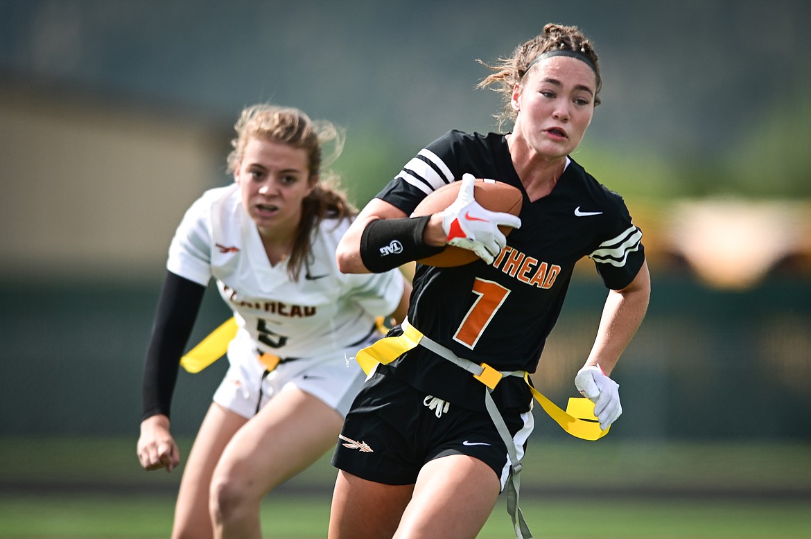 Peyton Walker (1) gets past a tackle attempt by Kaidyn Lake (5) during a Flathead Flag Football scrimmage at Legends Stadium on Saturday, Aug. 27. (Casey Kreider/Daily Inter Lake)